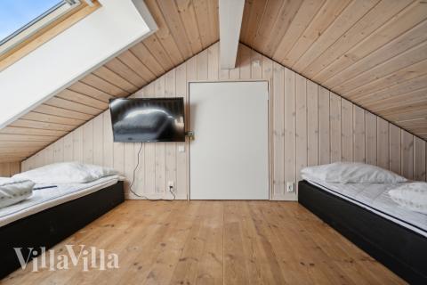 Några av de 22 sovplatserna finns på loftet i lyxstuga nr 192