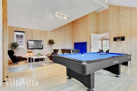 Tävla i sommarhusets aktivitetsrum när ni besöker lyxhus nr 280 i Sydjylland.