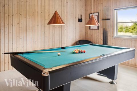 Tävla i sommarhusets aktivitetsrum när ni besöker lyxhus nr 202 i Lolland/Falster/Møn.