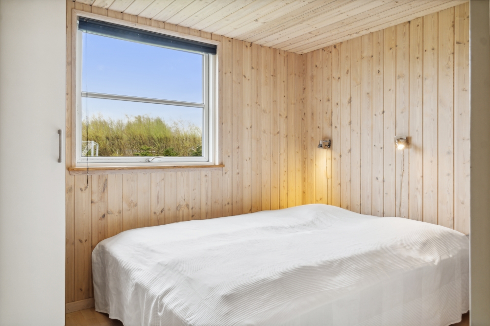 Ett av de 9 utmärkta sovrummen i lyxstuga nr 202 i Lolland/Falster/Møn.