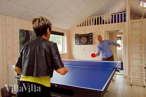 Underhållningen är säkrad i detta huset – med ett fullt utrustat aktivitetsrum med diverse spel