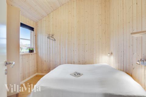 Ett av de 9 utmärkta sovrummen i lyxstuga nr 206 i Lolland/Falster/Møn.