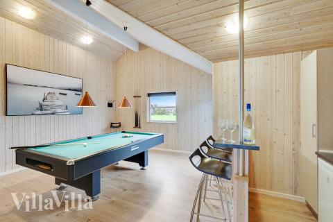 Aktivitetsrum i lyxstuga nr 206 med 9 sovrum och plats för 24 personer.