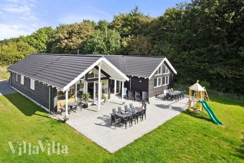 Detta härliga poolhus på Langeland bjuder på en skön semester med både avkoppling och hålligång