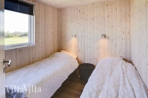 Ett av de 8 utmärkta sovrummen i lyxstuga nr 340 i Fyn och öar.