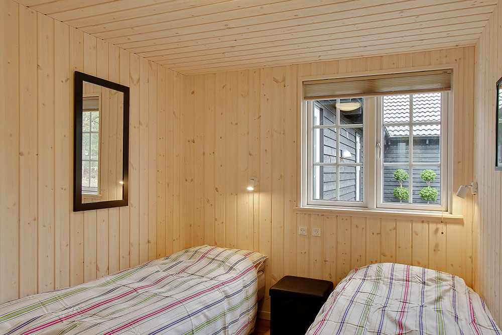 Ett av de 9 utmärkta sovrummen i lyxstuga nr 342 i Vestjylland.