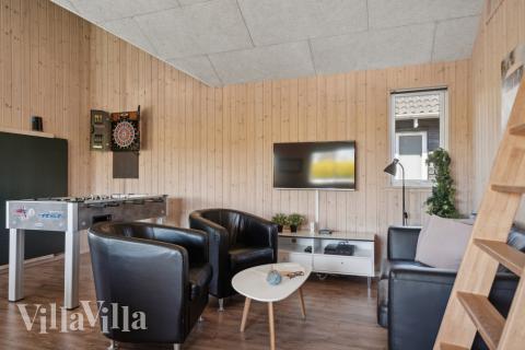 Tävla i sommarhusets aktivitetsrum när ni besöker lyxhus nr 345 i Fyn och öar.