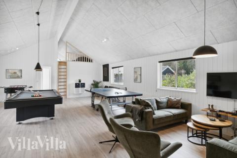 Tävla i sommarhusets aktivitetsrum när ni besöker lyxhus nr 350 i Nordsjälland.