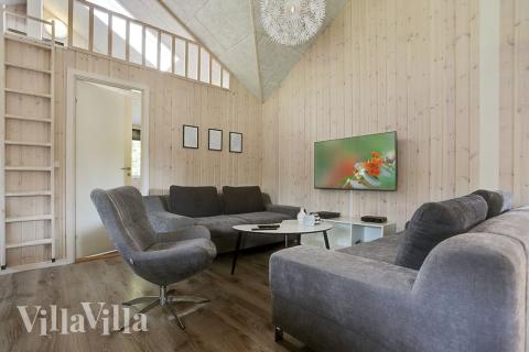 Tävla i sommarhusets aktivitetsrum när ni besöker lyxhus nr 369 i Nordsjälland.