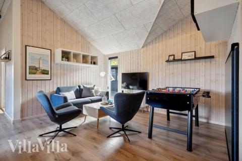 Aktivitetsrum i lyxstuga nr 371 med 9 sovrum och plats för 21 personer.