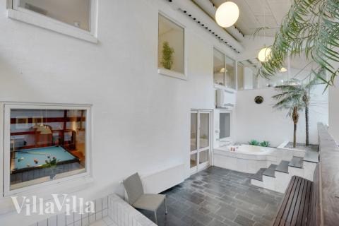 Njut av spabadets värme i lyxstuga nr 373 i Limfjorden