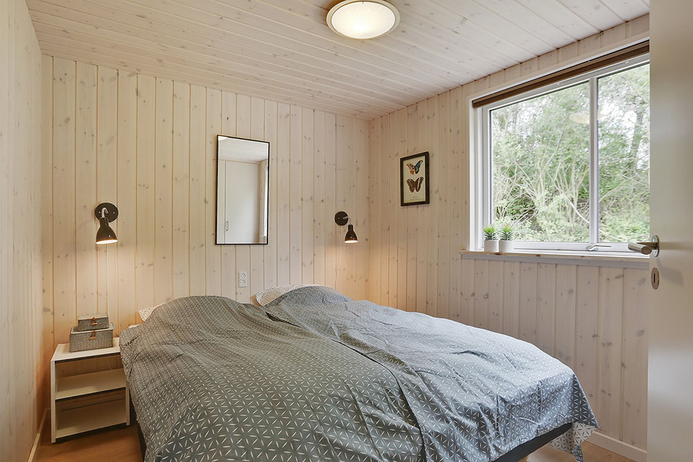 Ett av de 7 utmärkta sovrummen i lyxstuga nr 379 i Nordsjälland.