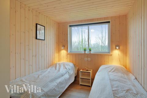 Ett av de 9 utmärkta sovrummen i lyxstuga nr 701 i Tyskland.