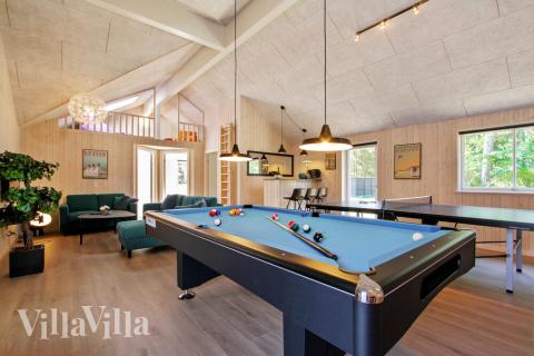 Tävla i sommarhusets aktivitetsrum när ni besöker lyxhus nr 410 i Nordsjälland.