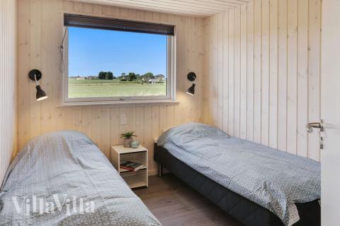 Ett av de 9 utmärkta sovrummen i lyxstuga nr 403 i Lolland/Falster/Møn.