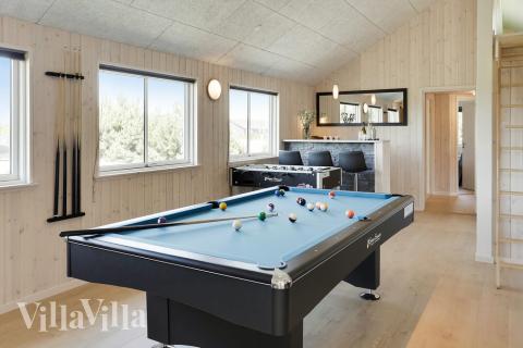 Tävla i sommarhusets aktivitetsrum när ni besöker lyxhus nr 413 i Lolland/Falster/Møn.