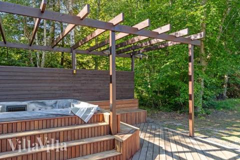 Njut av spabadets värme i lyxstuga nr 414 i Nordsjälland