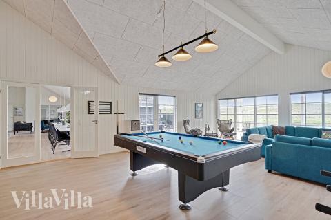 Tävla i sommarhusets aktivitetsrum när ni besöker lyxhus nr 442 i Østjylland.