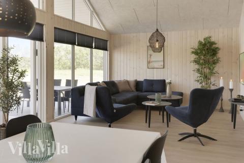 Det stora ljusa vardagsrummet i lyxstuga nr 433 för 16.