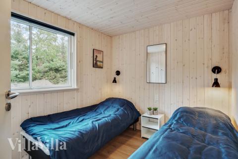 Ett av de 8 utmärkta sovrummen i lyxstuga nr 434 i Nordsjälland.