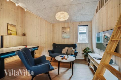 Tävla i sommarhusets aktivitetsrum när ni besöker lyxhus nr 434 i Nordsjälland.