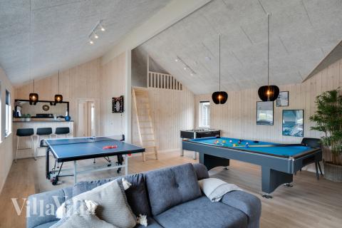 Tävla i sommarhusets aktivitetsrum när ni besöker lyxhus nr 456 i Vestjylland.