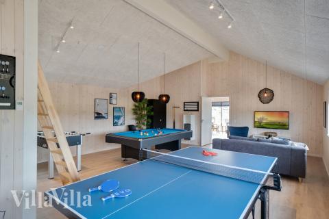 Aktivitetsrum i lyxstuga nr 456 med 8 sovrum och plats för 20 personer.