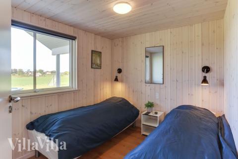 Ett av de 9 utmärkta sovrummen i lyxstuga nr 447 i Lolland/Falster/Møn.