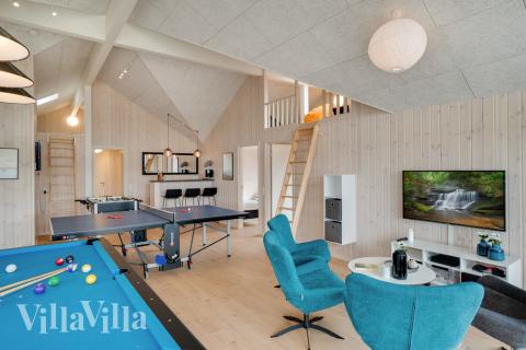 Tävla i sommarhusets aktivitetsrum när ni besöker lyxhus nr 465 i Vestjylland.