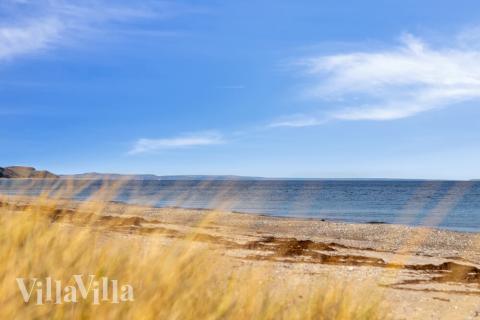 Stranden i närheten av lyxhus 489.