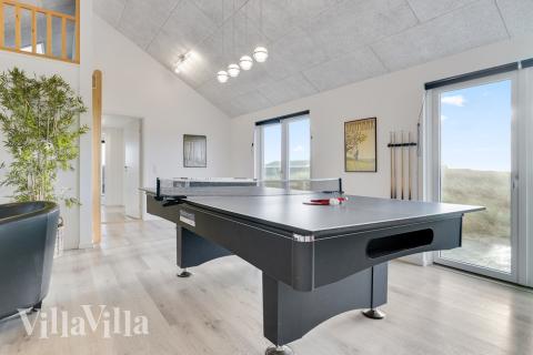 Tävla i sommarhusets aktivitetsrum när ni besöker lyxhus nr 486 i Vestjylland.