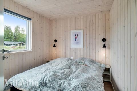 Ett av de 5 utmärkta sovrummen i lyxstuga nr 501 i Nordsjälland.