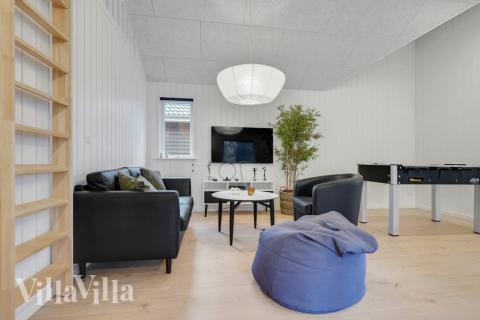 Tävla i sommarhusets aktivitetsrum när ni besöker lyxhus nr 513 i Lolland/Falster/Møn.