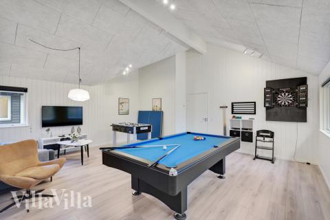 Tävla i sommarhusets aktivitetsrum när ni besöker lyxhus nr 517 i Lolland/Falster/Møn.