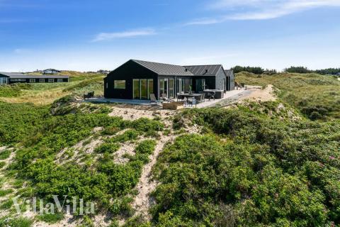 Njut av spabadets värme i lyxstuga nr 514 i Nordjylland