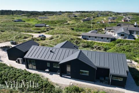 Stranden i närheten av lyxhus 514.