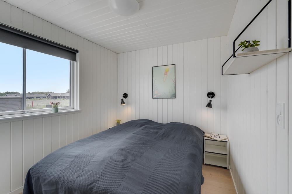 Ett av de 9 utmärkta sovrummen i lyxstuga nr 516 i Vestjylland.