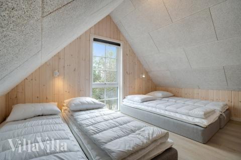 Några av de 14 sovplatserna finns på loftet i lyxstuga nr 518