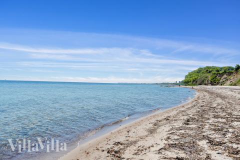 Stranden i närheten av lyxhus 488.