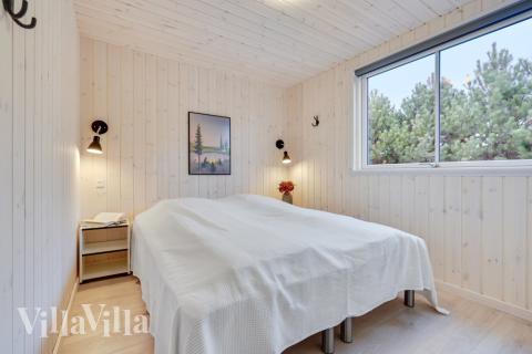 Ett av de 8 utmärkta sovrummen i lyxstuga nr 532 i Lolland/Falster/Møn.