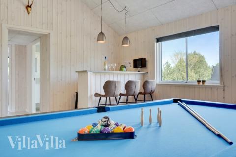 Tävla i sommarhusets aktivitetsrum när ni besöker lyxhus nr 525 i Lolland/Falster/Møn.