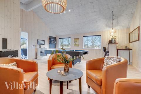 Tävla i sommarhusets aktivitetsrum när ni besöker lyxhus nr 524 i Sydjylland.