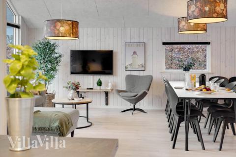 Vardagsrummet i lyxstuga nr. 550 har plats för 14 personer.