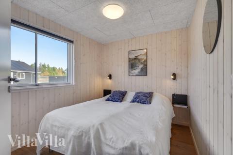 Ett av de 6 utmärkta sovrummen i lyxstuga nr 568 i Vestjylland.