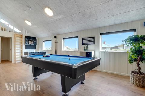 Tävla i sommarhusets aktivitetsrum när ni besöker lyxhus nr 558 i Vestjylland.