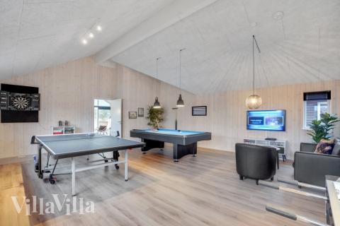 Tävla i sommarhusets aktivitetsrum när ni besöker lyxhus nr 545 i Limfjorden.