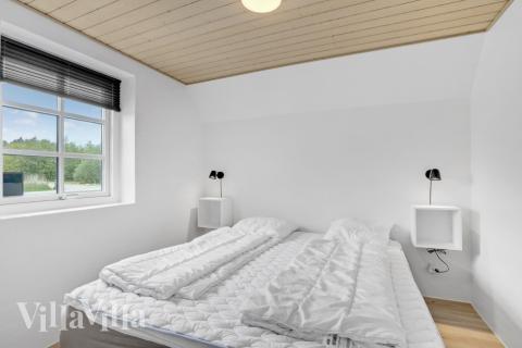 Ett av de 7 utmärkta sovrummen i lyxstuga nr 576 i Vestjylland.