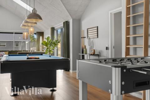 Tävla i sommarhusets aktivitetsrum när ni besöker lyxhus nr 554 i Vestjylland.