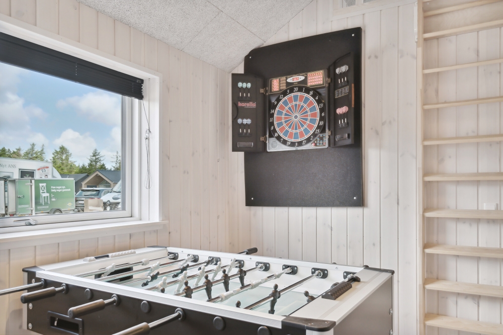 Aktivitetsrum i lyxstuga nr 601 med 7 sovrum och plats för 18 personer.