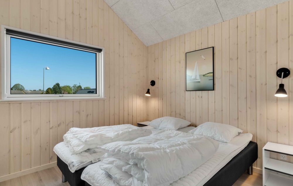 Ett av de 5 utmärkta sovrummen i lyxstuga nr 582 i Nordsjälland.